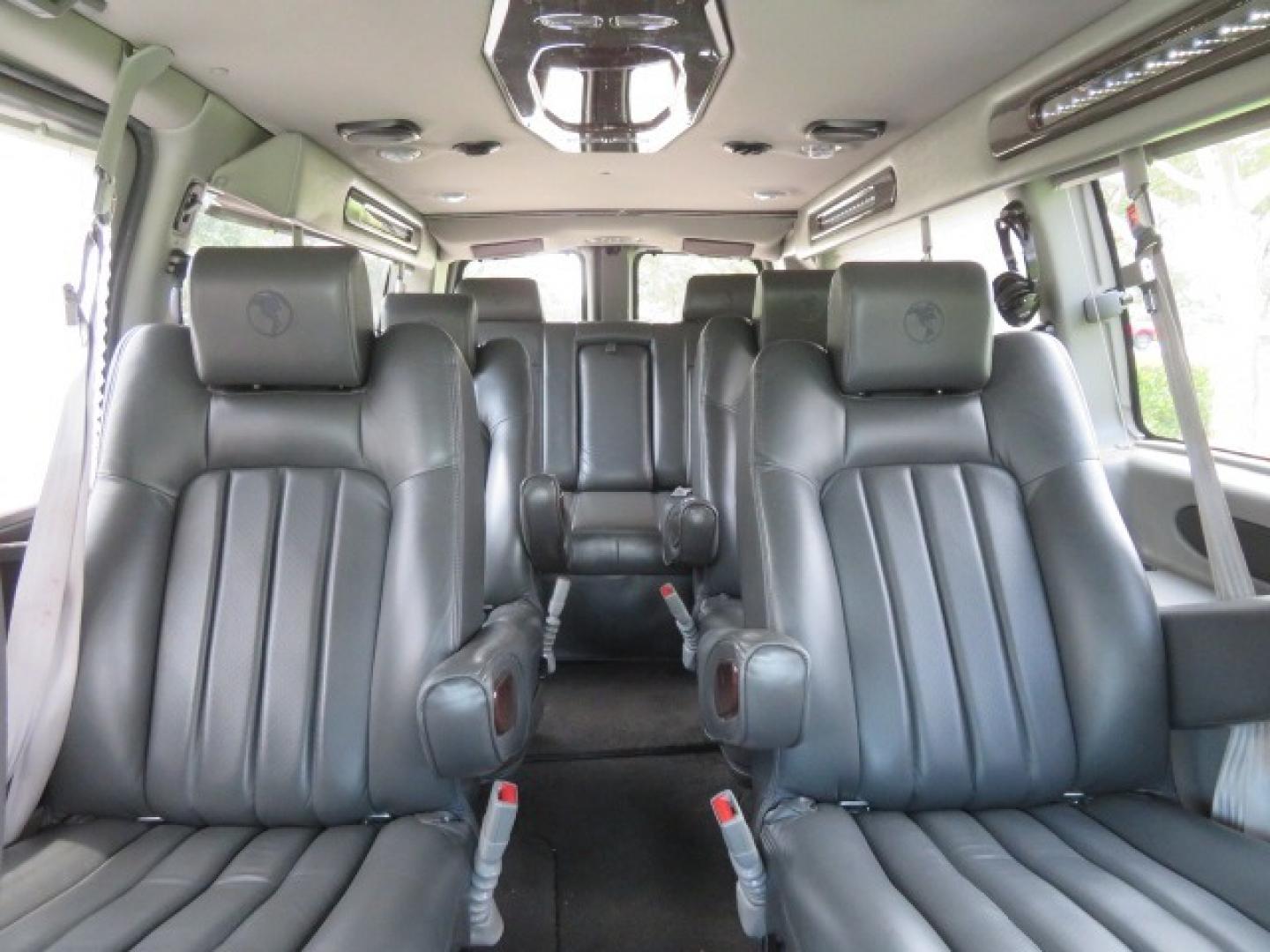 2014 Chevrolet Express (1GBWGLCG3E1) , located at 4301 Oak Circle #19, Boca Raton, FL, 33431, (954) 561-2499, 26.388861, -80.084038 - You are looking at a Rare 2014 Chevy Express 2500 Quigley 4x4 Four Wheel Drive Explorer Limited SE 9 Passenger Conversion Van with: 107K Original Miles, 6 Captain Chairs, Rear Power Folding Bench Seat Bed, Center Consoler Cooler, Front PPF (Paint Protection Film) Explorer Limited Conversion Througho - Photo#54